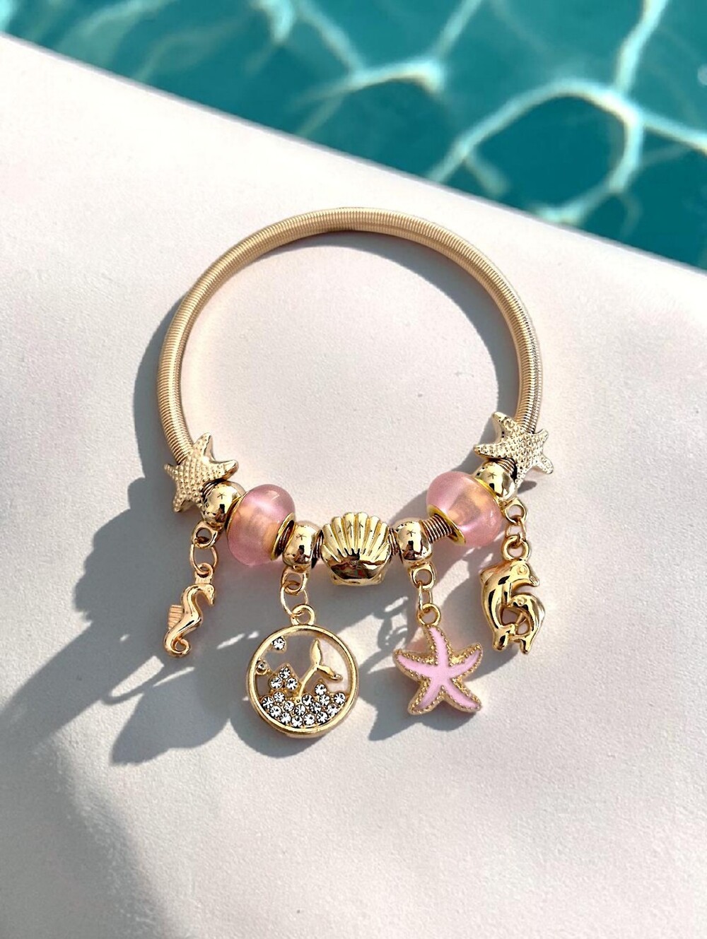 Gold Ocean Charm Bracelet with Light Pink Starfish